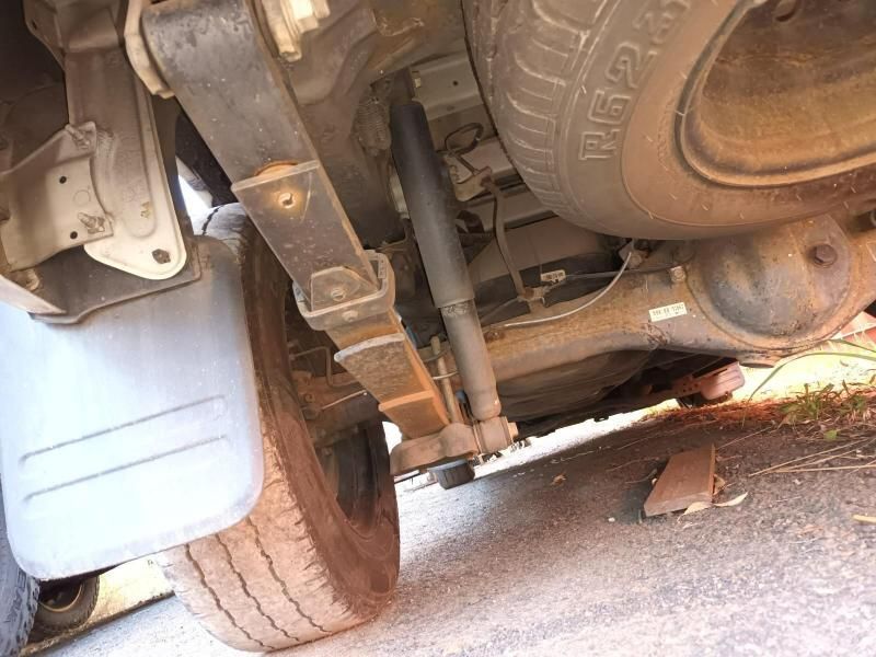 A Close Up of the Underside of a Car With a Tire on the Ground — South West 4WD Wreckers In Harristown, QLD