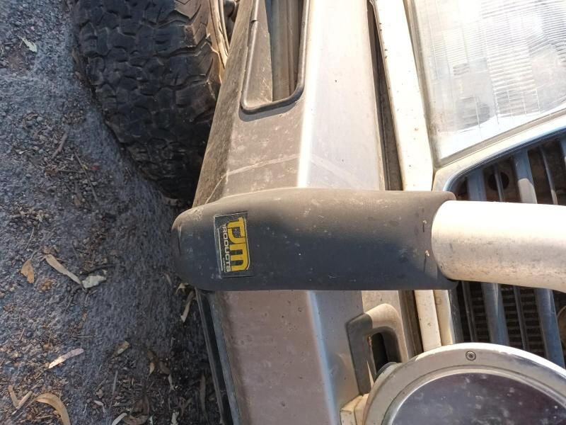 A Close Up of the Front of a Car With the Word Dm on It — South West 4WD Wreckers In Harristown, QLD