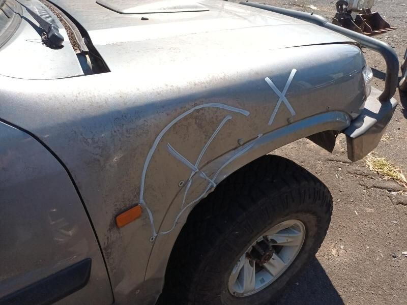 A Car With a Broken Fender Has a White X Drawn on It — South West 4WD Wreckers In Harristown, QLD