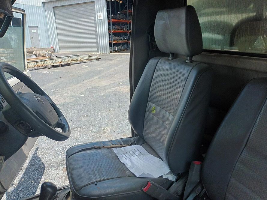 The Inside of a Car with a Steering Wheel and Seats — South West 4WD Wreckers in Harristown, QLD 