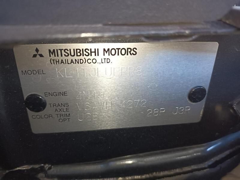 A Close Up of a Mitsubishi Motors Label on a Car — South West 4WD Wreckers In Harristown, QLD