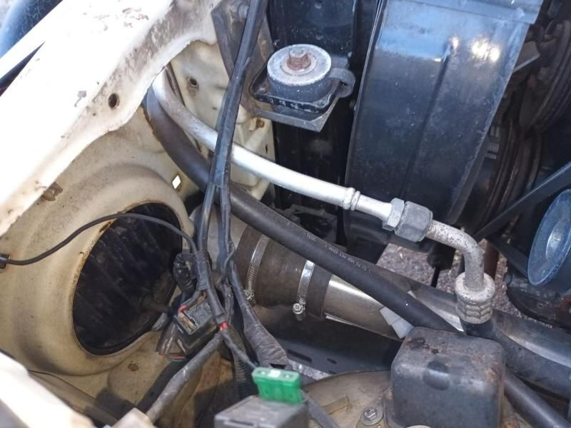 A Close Up of a Car Engine With a Green Fuse — South West 4WD Wreckers In Brisbane, QLD