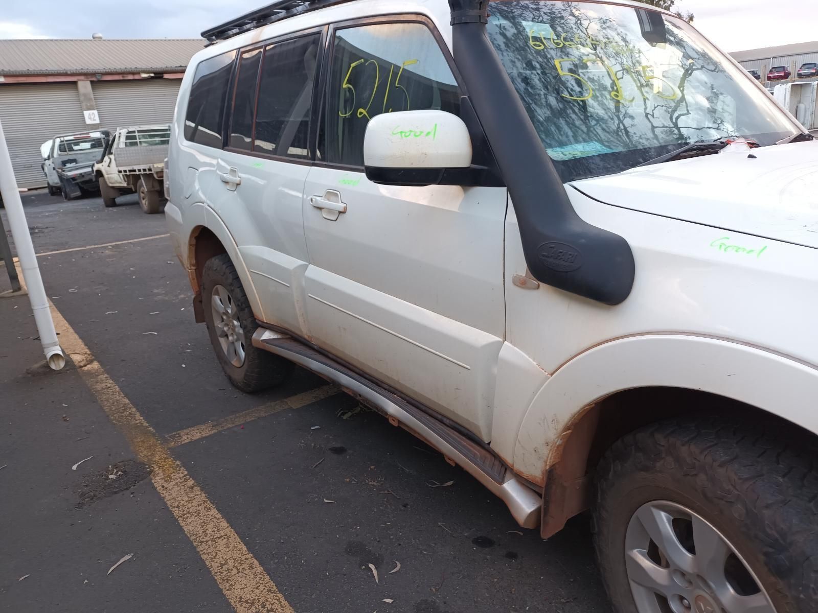 A White Suv With a Snorkel is Parked in a Parking Lot — South West 4WD Wreckers In Brisbane, QLD