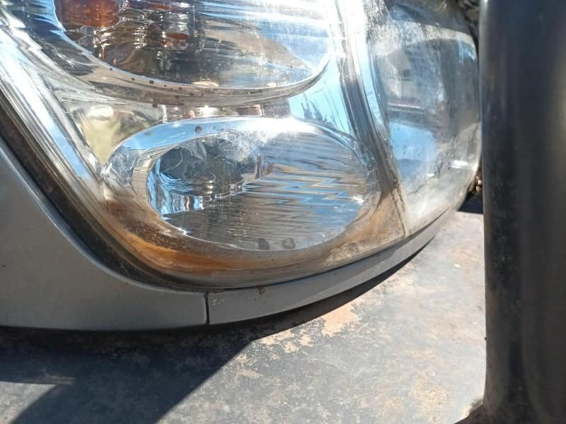 A Close Up of a Car 's Headlight Sitting Next to a Pole — South West 4WD Wreckers In Harristown, QLD