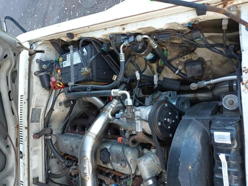 A Close Up of a Car Engine With the Hood Open — South West 4WD Wreckers In Brisbane, QLD