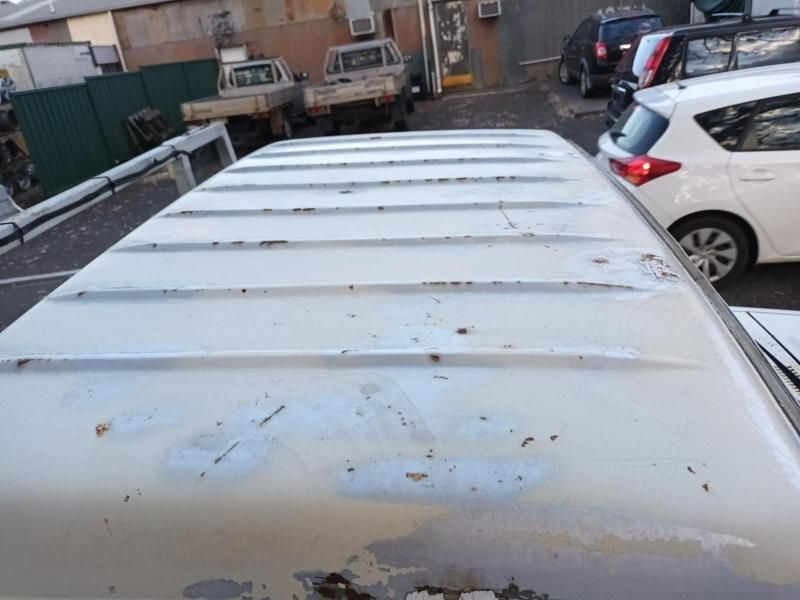 A White Van is Parked in a Parking Lot With Other Cars — South West 4WD Wreckers In Brisbane, QLD