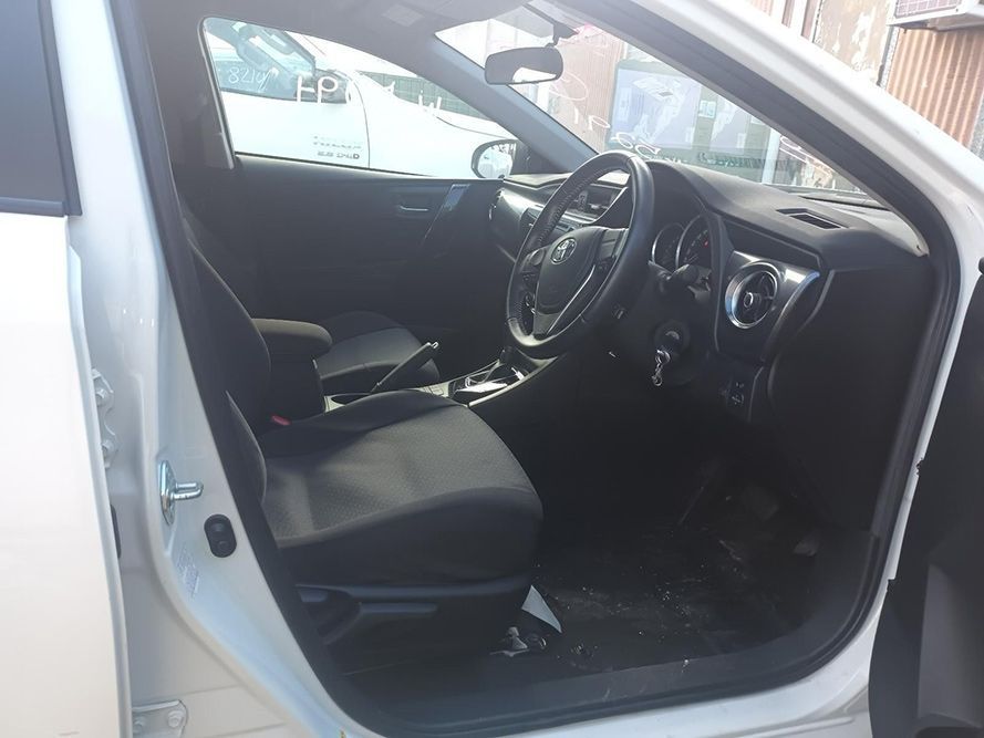 The Inside of a White Car with the Door Open — South West 4WD Wreckers in Harristown, QLD