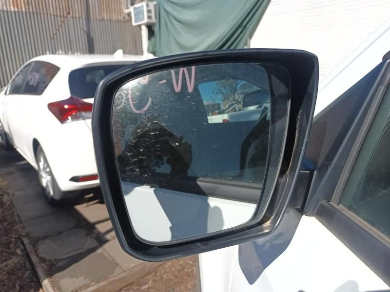 A Side View Mirror on a White Car Has the Letters Cw Written on It — South West 4WD Wreckers In Harristown, QLD