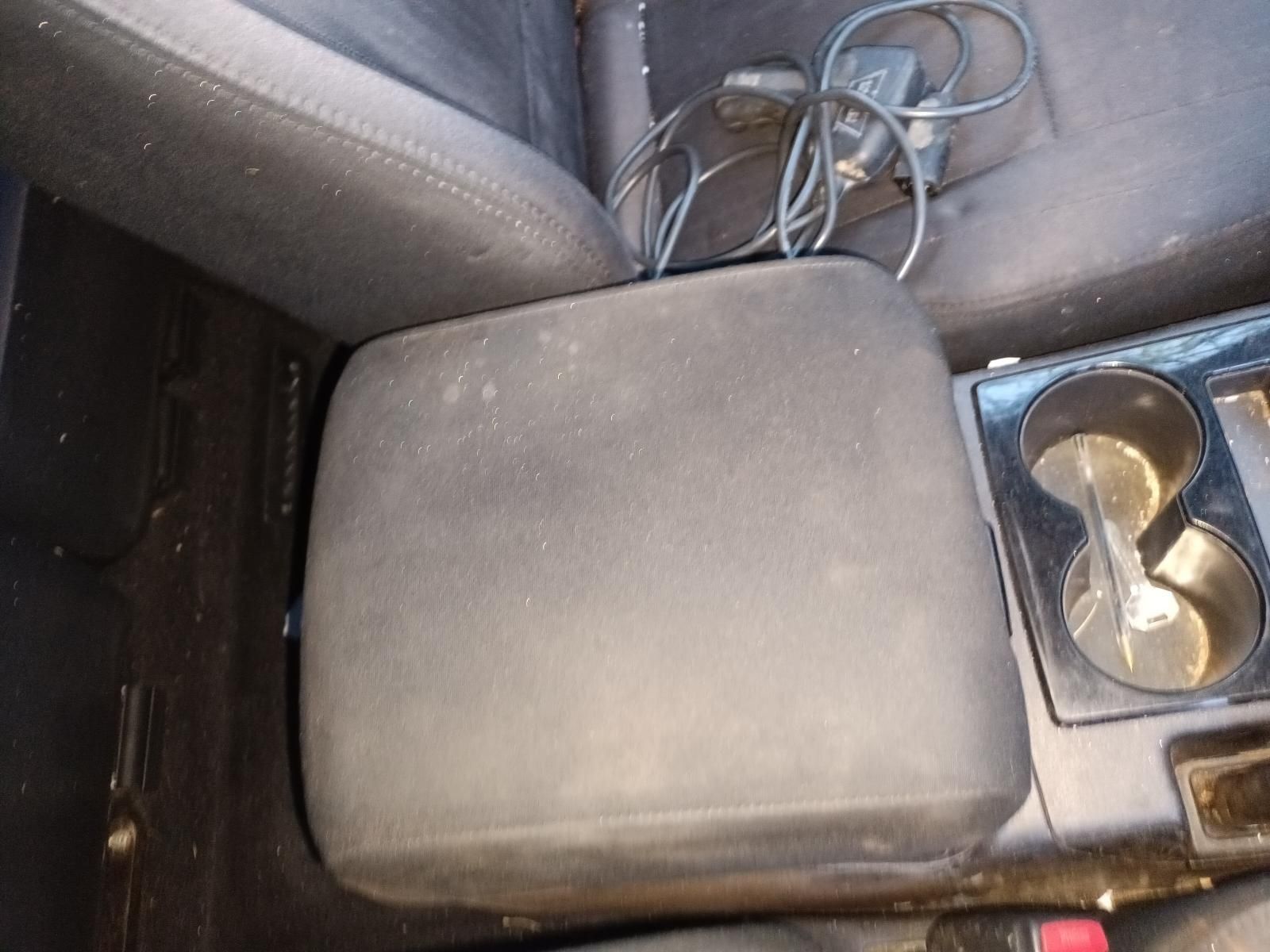 A Black Arm Rest in a Car Next to a Cup Holder — South West 4WD Wreckers In Brisbane, QLD