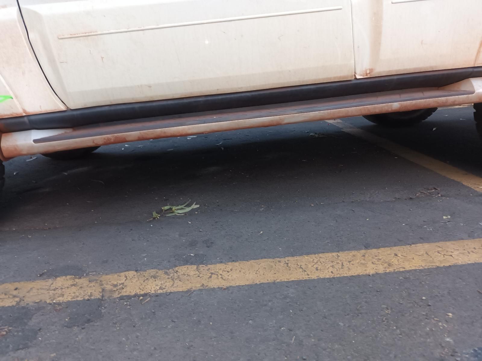A White Truck is Parked in a Parking Lot — South West 4WD Wreckers In Brisbane, QLD