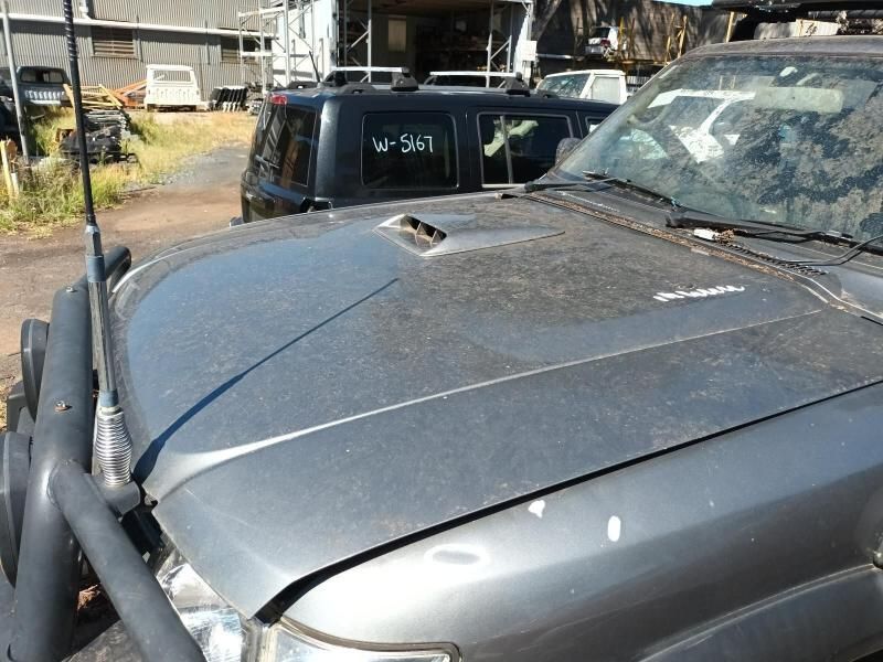 A Gray Truck With the Hood Up is Parked in a Parking Lot — South West 4WD Wreckers In Harristown, QLD