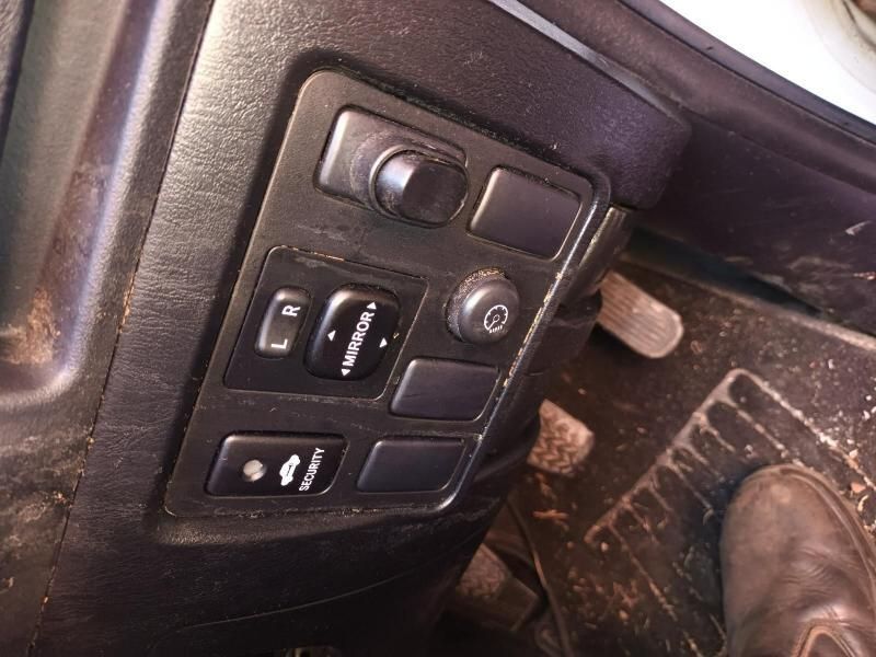 A Person 's Foot is on the Brake Pedal of a Car — South West 4WD Wreckers In Harristown, QLD
