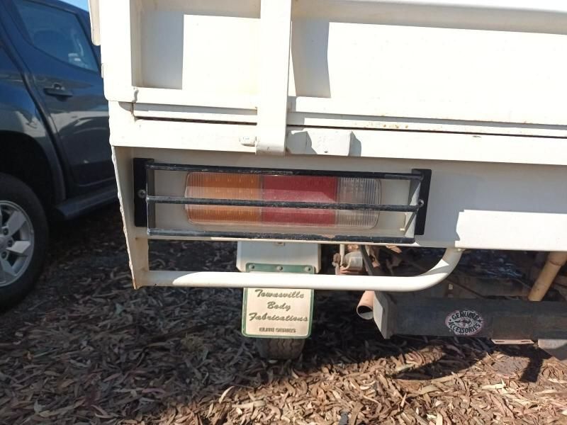 A White Truck With a License Plate That Says Community — South West 4WD Wreckers In Brisbane, QLD