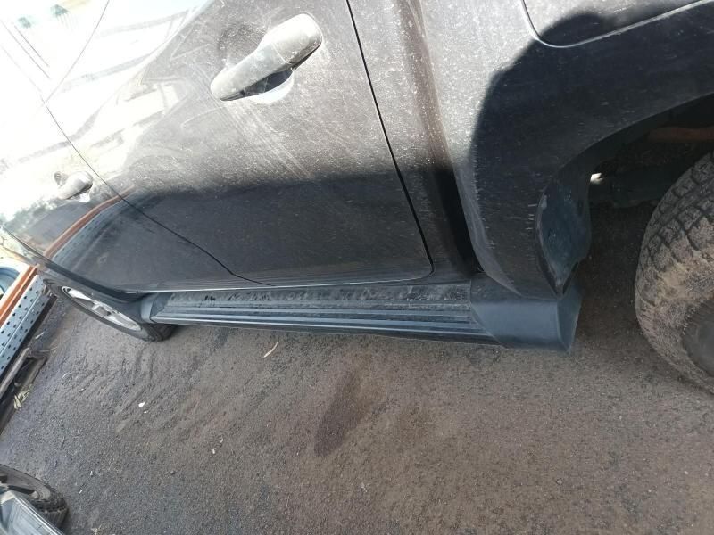 A Black Truck is Parked on the Side of the Road — South West 4WD Wreckers In Harristown, QLD