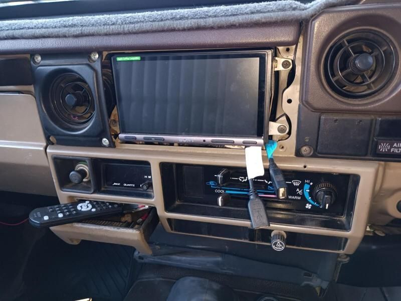 A Car Dashboard With a Remote Control and a Radio — South West 4WD Wreckers In Brisbane, QLD