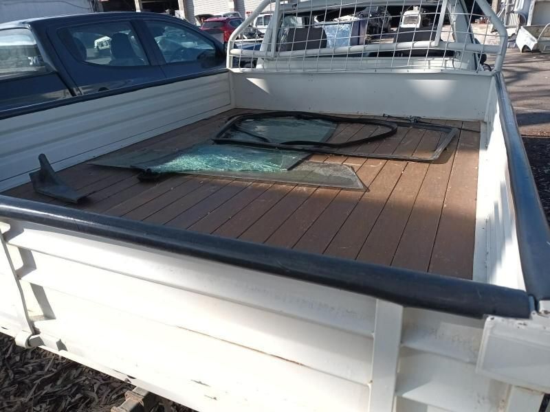 The Back of a Truck With a Wooden Deck and a Broken Window — South West 4WD Wreckers In Brisbane, QLD