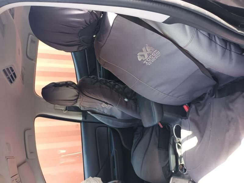 A Person is Sitting in the Back Seat of a Car — South West 4WD Wreckers In Harristown, QLD