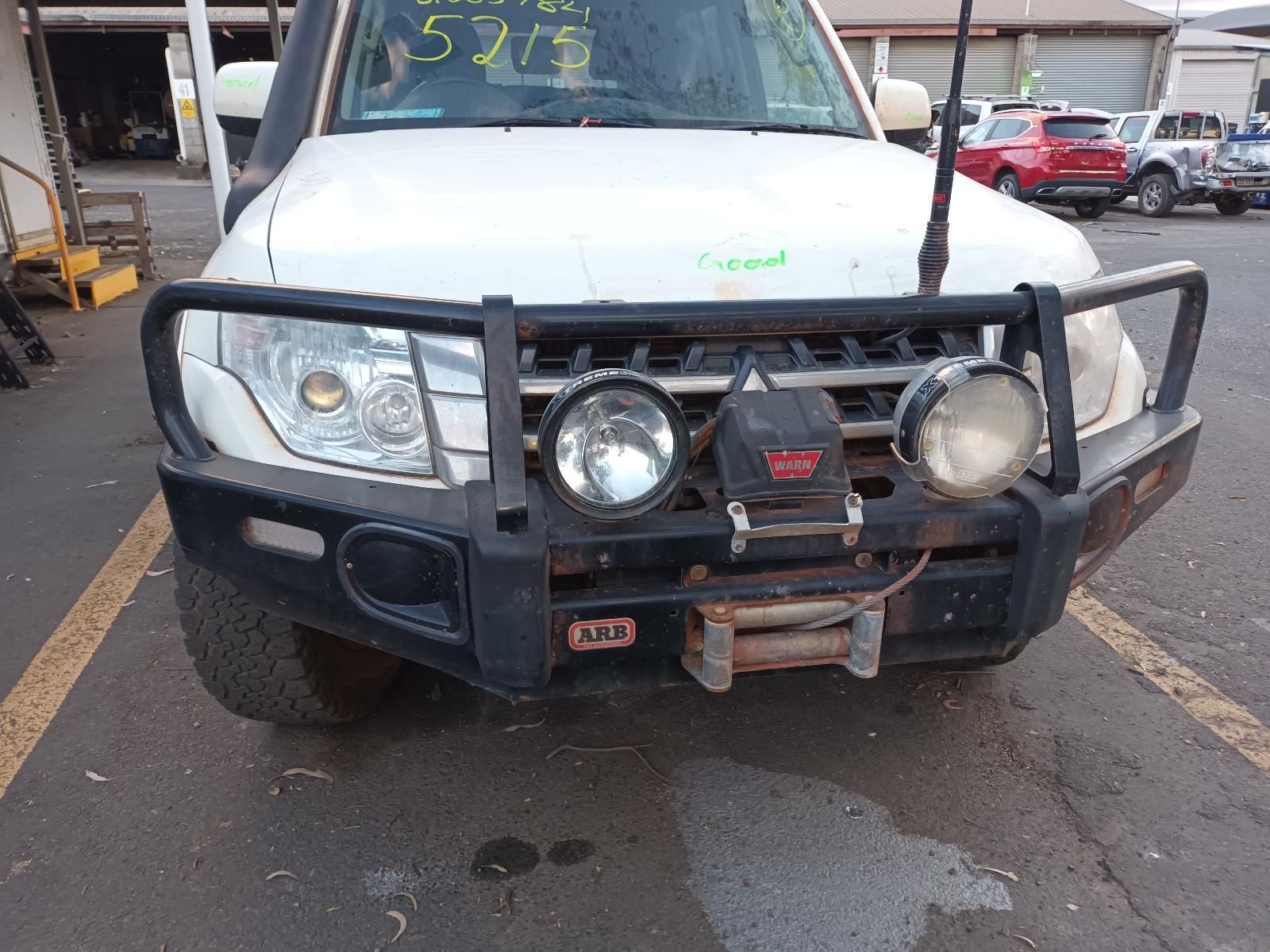 A White Suv With a Black Bumper is Parked in a Parking Lot — South West 4WD Wreckers In Brisbane, QLD