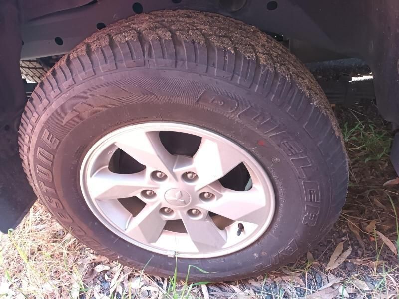 A Close Up of a Tire on a Car on the Ground — South West 4WD Wreckers In Harristown, QLD
