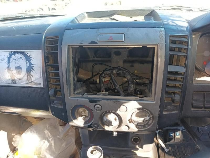 The Dashboard of a Car With a Picture of a Man on It — South West 4WD Wreckers In Harristown, QLD