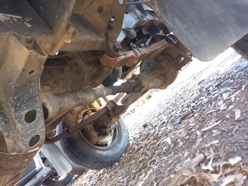 A Close Up of the Underside of a Truck With a Tire on the Ground — South West 4WD Wreckers In Brisbane, QLD