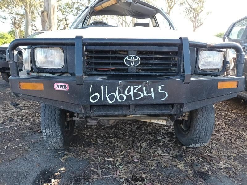 A White Toyota Truck With the License Plate 61066345 — South West 4WD Wreckers In Brisbane, QLD