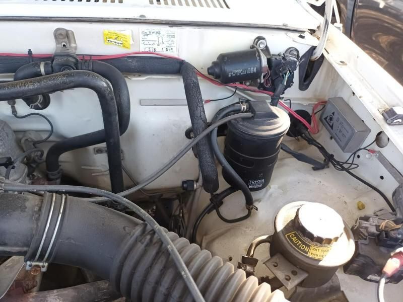 A Close Up of the Engine of a White Car — South West 4WD Wreckers In Brisbane, QLD