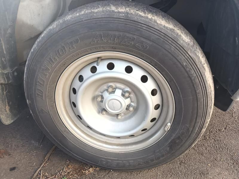 A Close Up of a Car Tire With a Metal Rim — South West 4WD Wreckers In Harristown, QLD