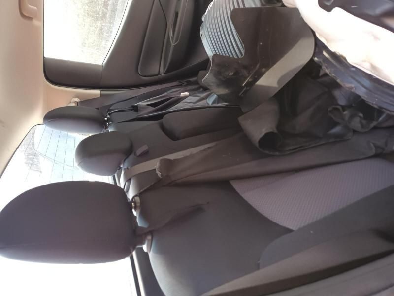 A Person is Sitting in the Back Seat of a Car — South West 4WD Wreckers In Harristown, QLD