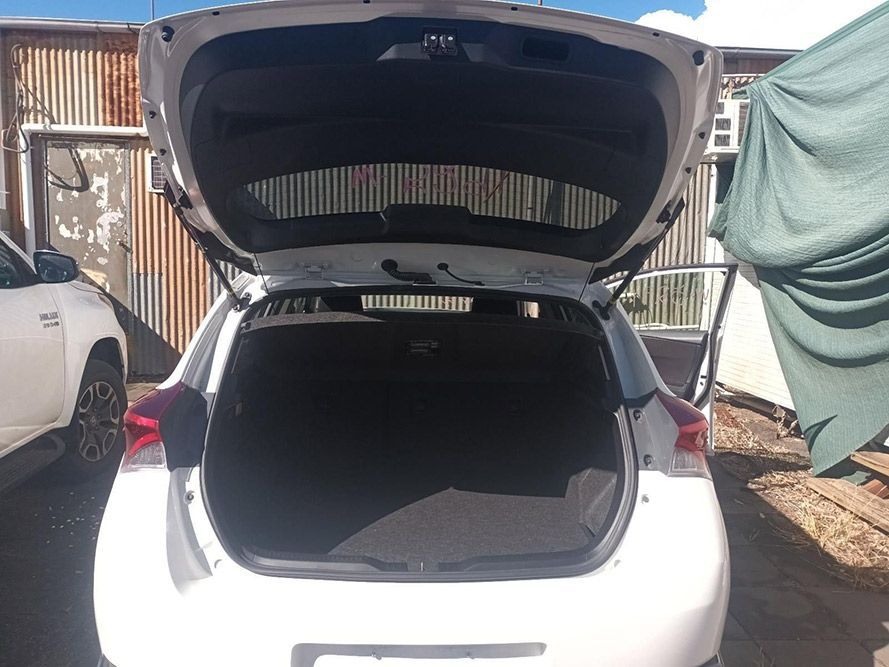 The Back of a White Car with the Trunk Open — South West 4WD Wreckers in Harristown, QLD