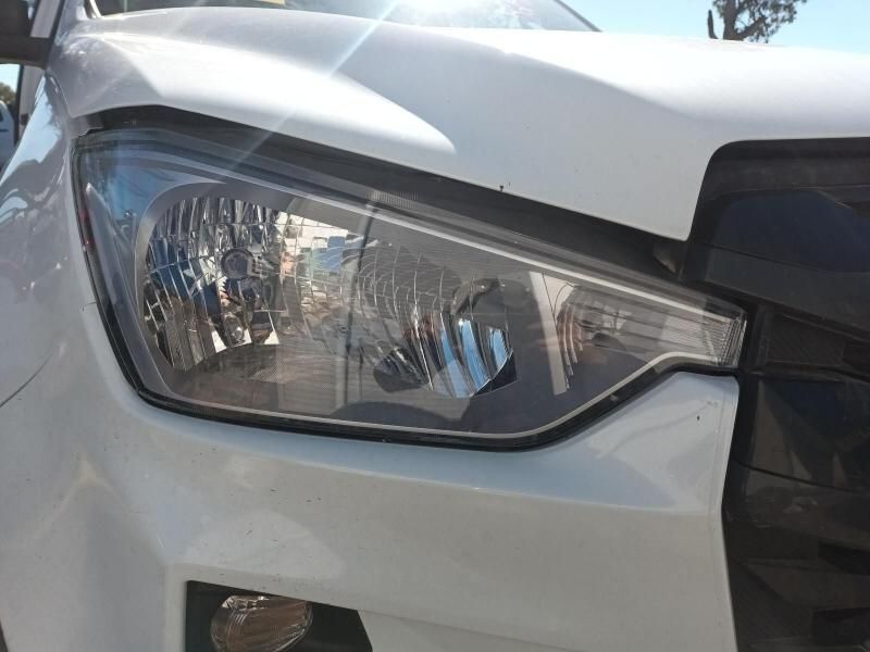A Close Up of a White Car 's Headlight on a Sunny Day — South West 4WD Wreckers In Harristown, QLD