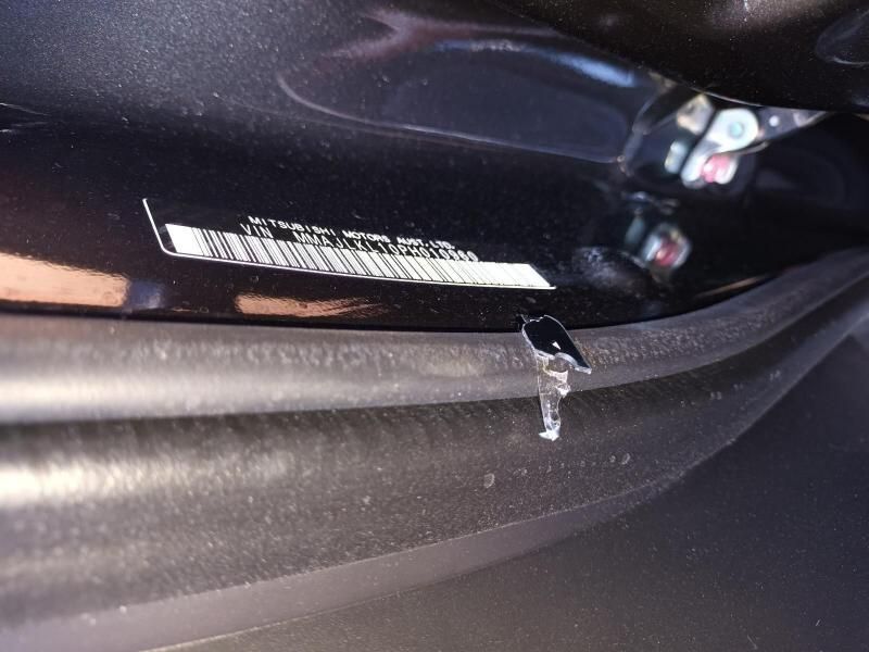 A Close Up of a Black Car With a Sticker on It — South West 4WD Wreckers In Harristown, QLD