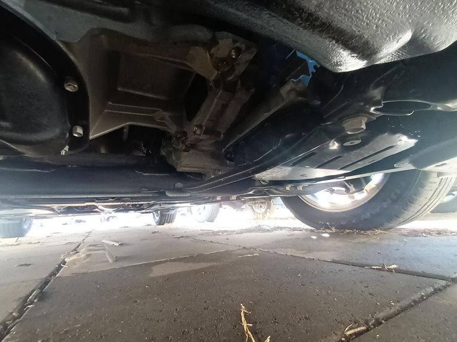 A Close Up of the Underside of a Car Parked on a Sidewalk — South West 4WD Wreckers in Harristown, QLD