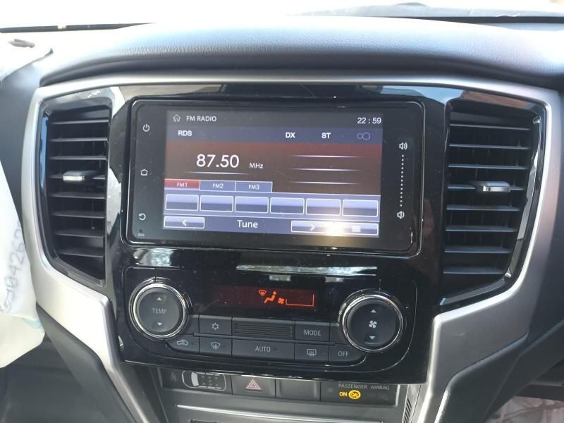 A Car Dashboard With a Radio That Says 87.50 on It — South West 4WD Wreckers In Harristown, QLD