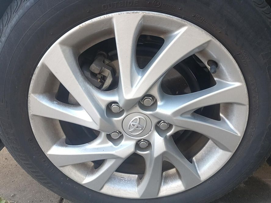 A Close Up of a Car Wheel with a Toyota Logo on It — South West 4WD Wreckers in Harristown, QLD