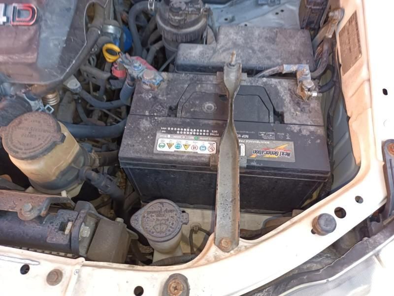 A Close Up of a Car Engine With a Battery and a Wrench — South West 4WD Wreckers In Harristown, QLD