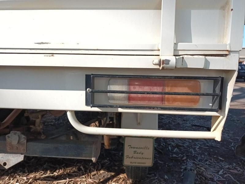 A White Truck With a License Plate That Says Toyota Parts on It — South West 4WD Wreckers In Brisbane, QLD