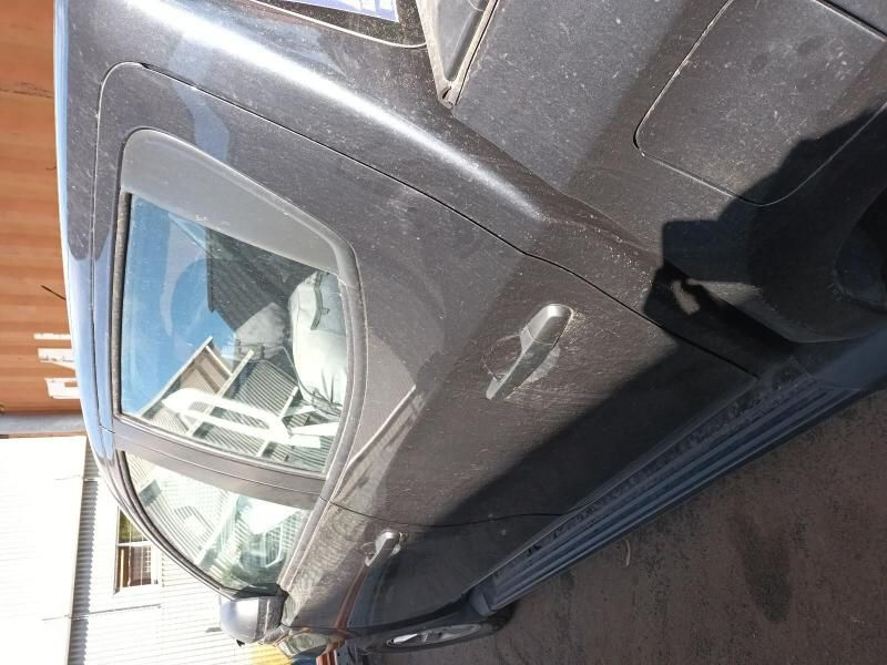 A Black Car is Parked on the Side of the Road — South West 4WD Wreckers In Harristown, QLD