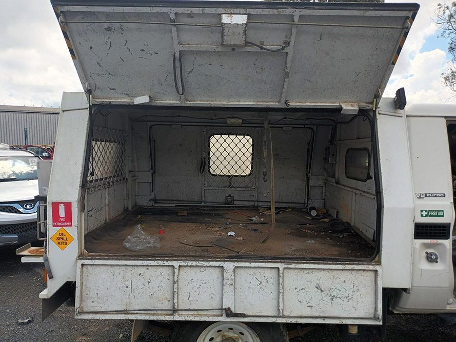 The Back of a White Truck with the Door Open — South West 4WD Wreckers in Harristown, QLD 