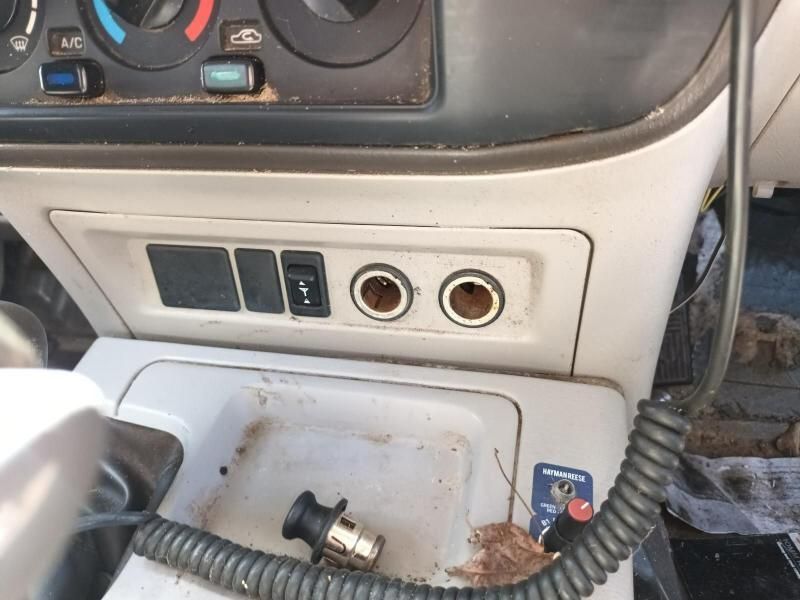 Close-up of a Car's Dashboard With a Damaged Radio and Tangled Wires — South West 4WD Wreckers In Harristown, QLD