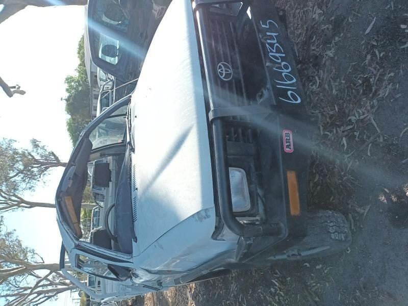 A Toyota Truck With a License Plate That Says 61676545 — South West 4WD Wreckers In Brisbane, QLD