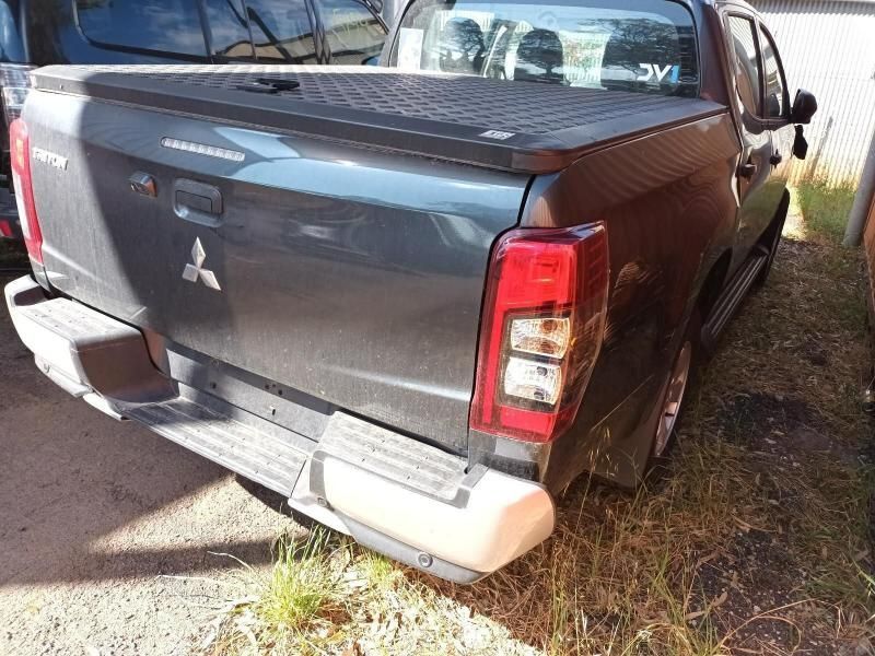 The Back End of a Mitsubishi Triton Pickup Truck is Shown — South West 4WD Wreckers In Harristown, QLD