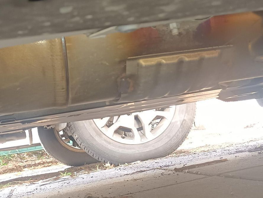 A Close Up of the Underside of a Car with a Tire — South West 4WD Wreckers in Harristown, QLD