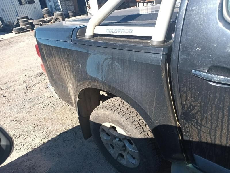 A Black Colorado Truck is Parked in the Dirt — South West 4WD Wreckers In Harristown, QLD