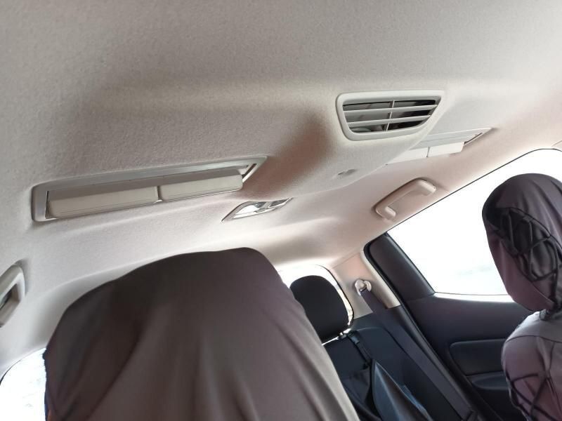 A Woman is Sitting in the Back Seat of a Car — South West 4WD Wreckers In Harristown, QLD