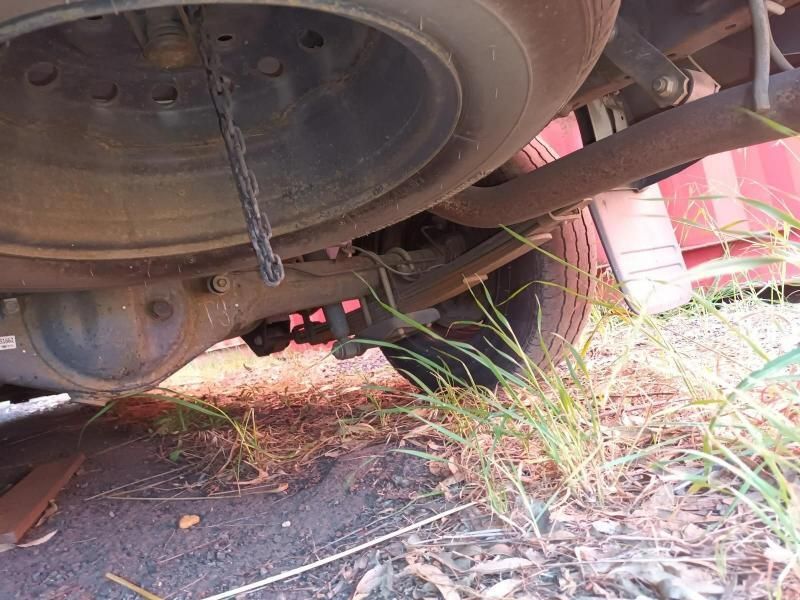 A Close Up of the Underside of a Car With Grass Growing Out of It — South West 4WD Wreckers In Harristown, QLD
