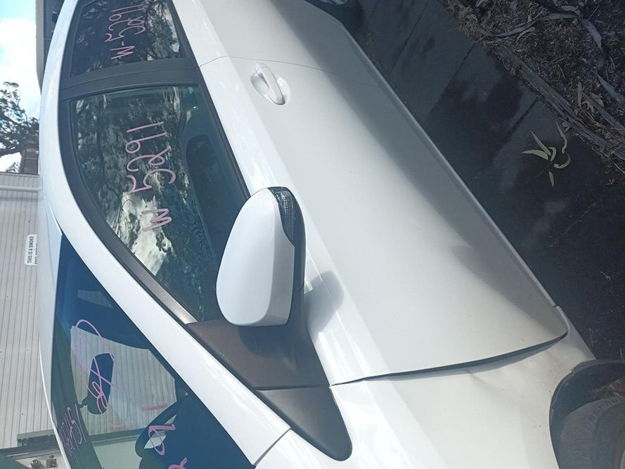 A White Car with the Word Sell Written on the Side — South West 4WD Wreckers in Harristown, QLD