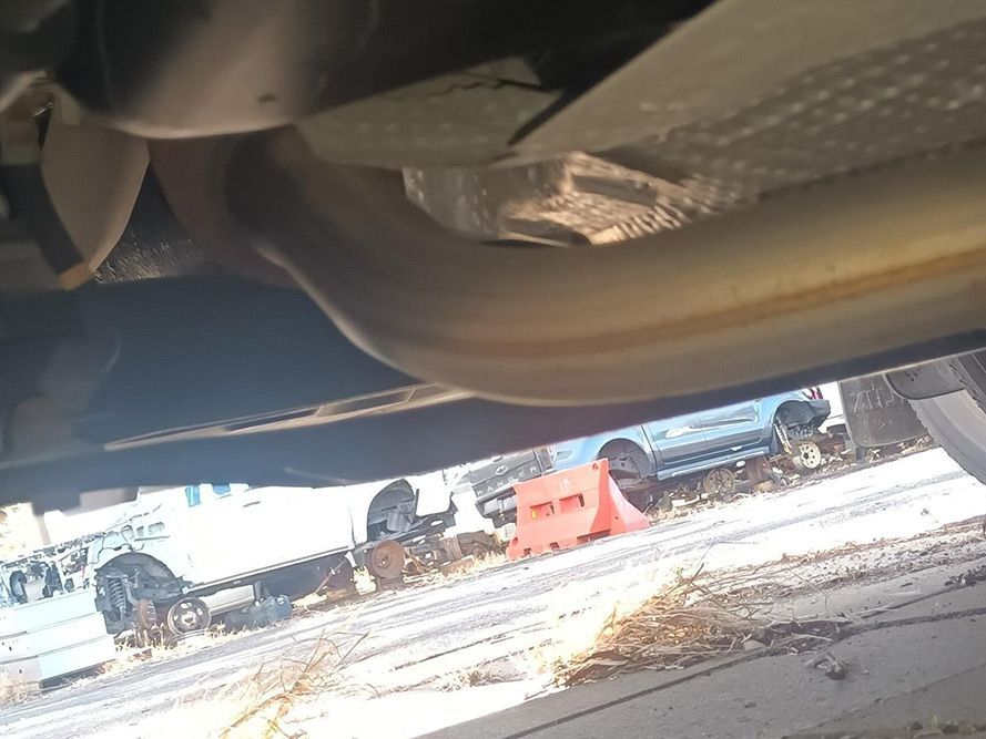 A Close Up of a Car Exhaust Pipe in a Parking Lot — South West 4WD Wreckers in Harristown, QLD