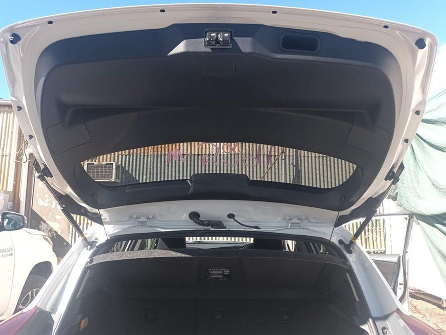 The Back of a White Car with the Trunk Open — South West 4WD Wreckers in Harristown, QLD
