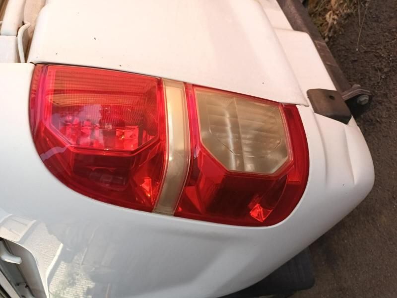 A White Car With a Red Tail Light on It — South West 4WD Wreckers In Harristown, QLD